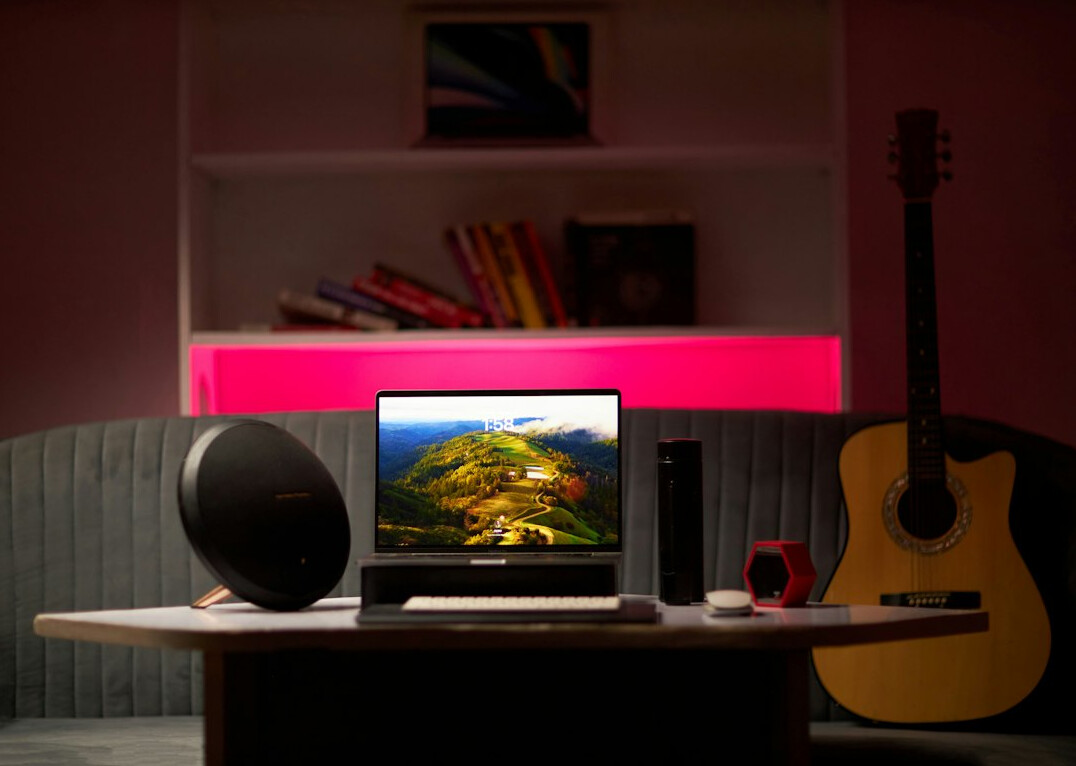 Audio waveform displayed on a laptop screen in a home studio