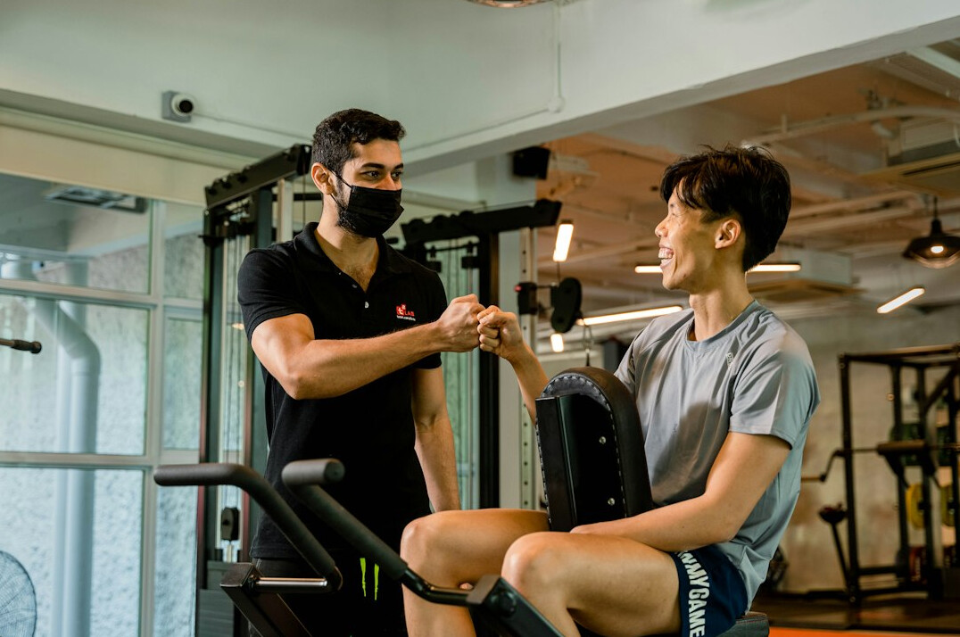 Young man practicing a speech exercise with a coach